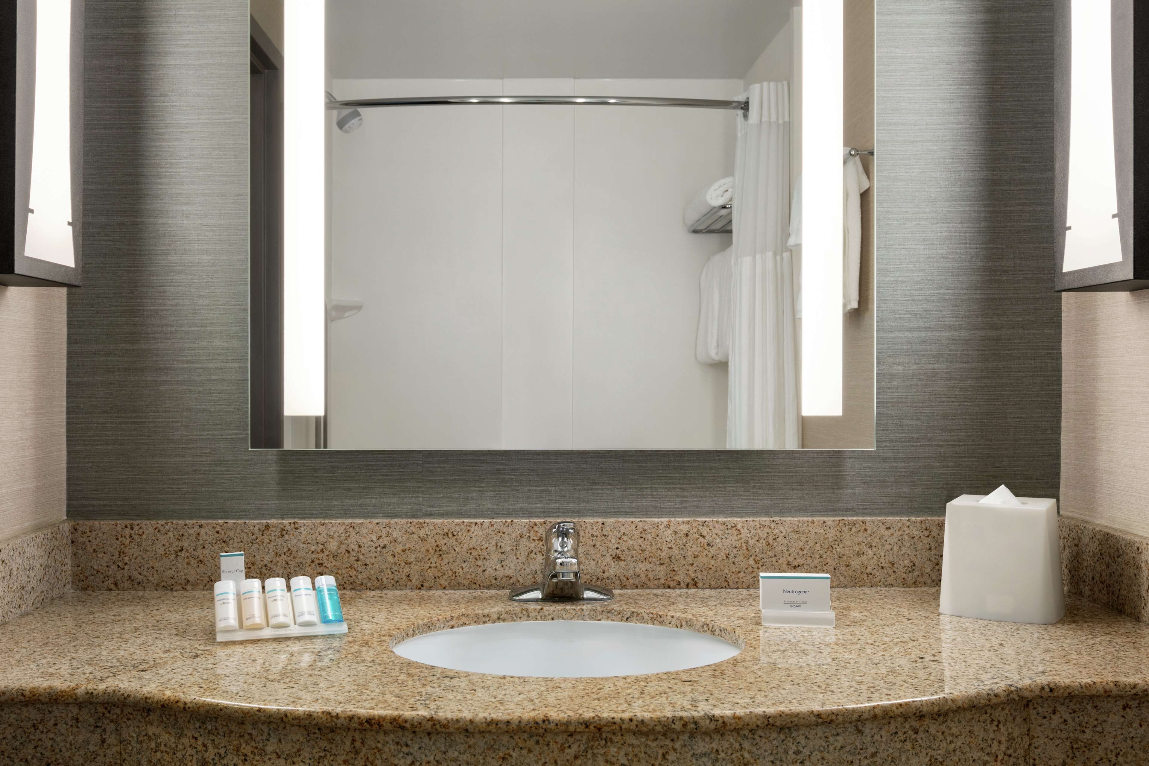 shower, designer toiletries, hair dryer, towels