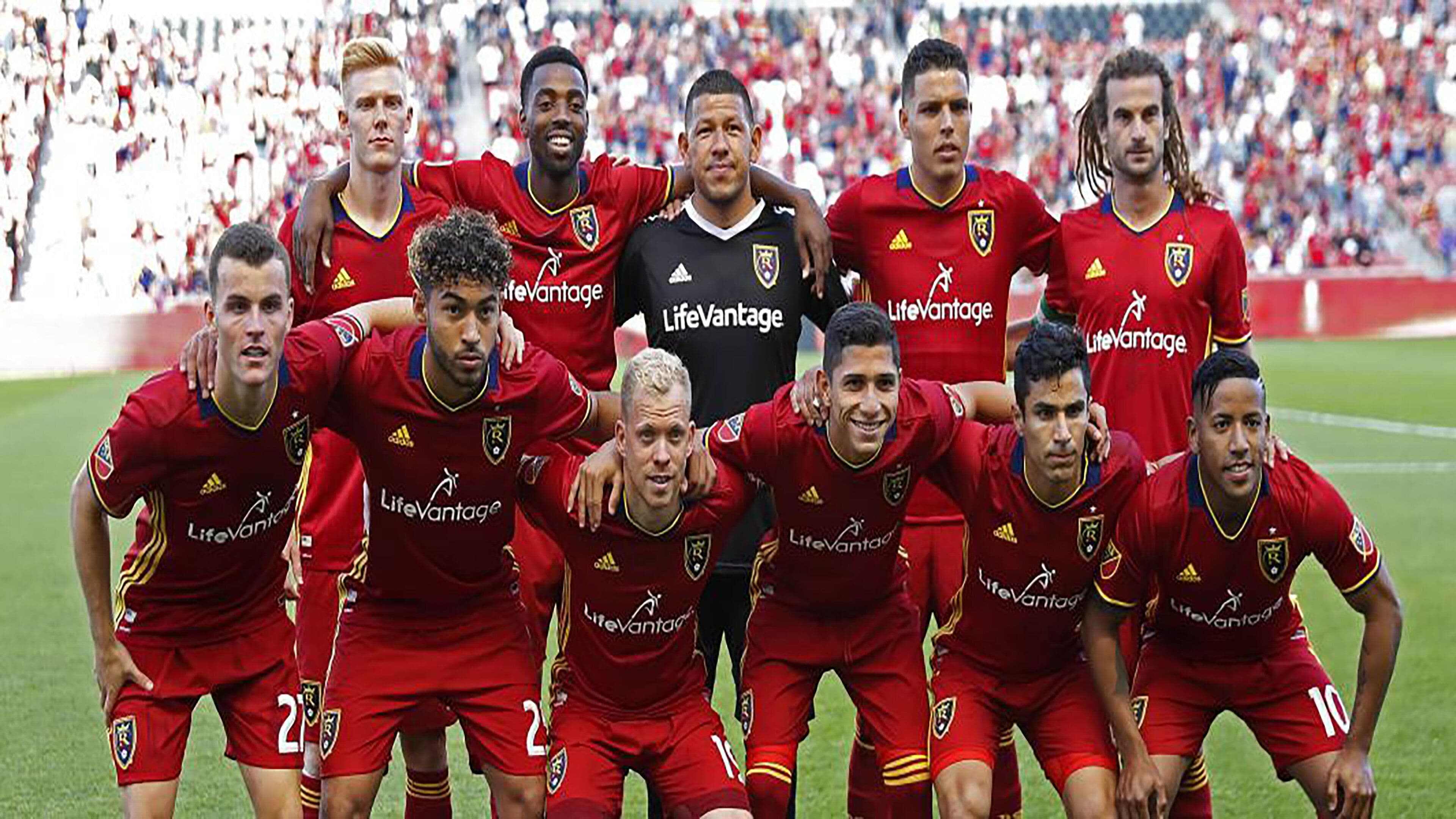 A soccer team posing for a group photo.