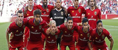 A soccer team posing for a group photo.
