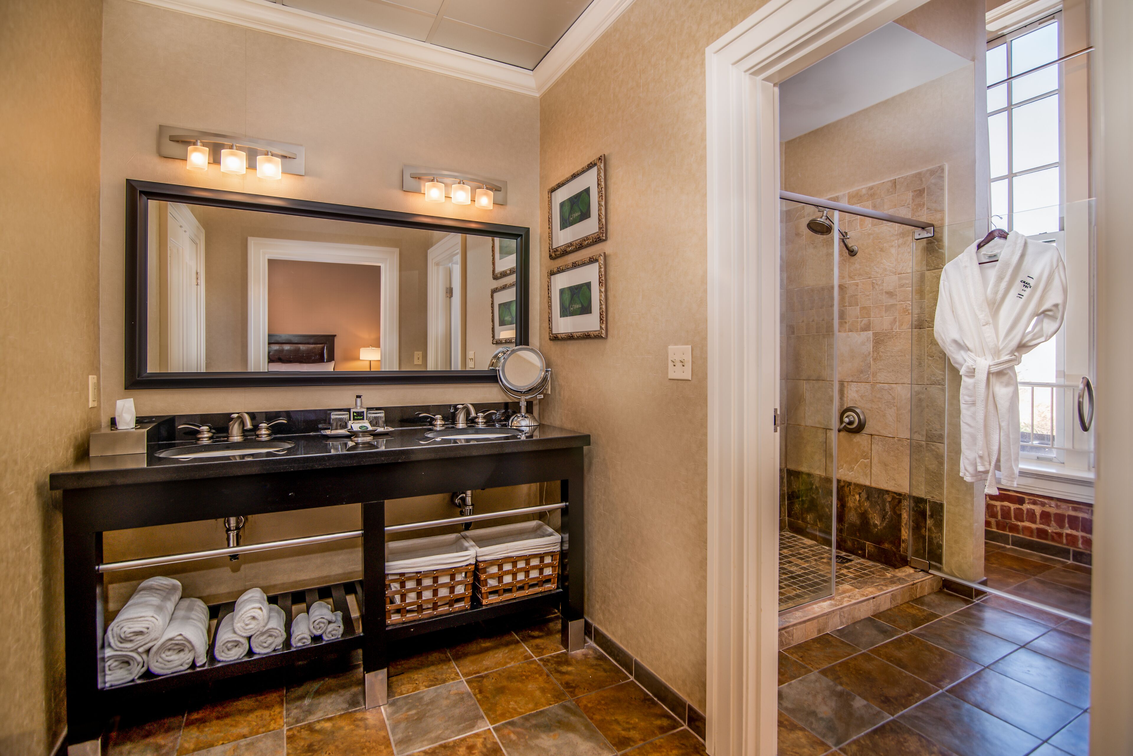 combined shower/bathtub, designer toiletries, hair dryer, bathrobes