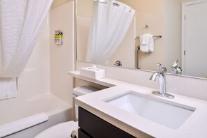 A modern bathroom with a sink, mirror, and towel rack. - Candlewood Suites Sierra Vista by IHG (Sierra Vista)
