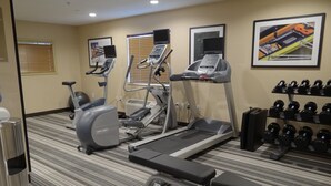 A gym with treadmills, an elliptical, a bench, and a rack of dumbbells. - Candlewood Suites Sierra Vista by IHG (Sierra Vista)