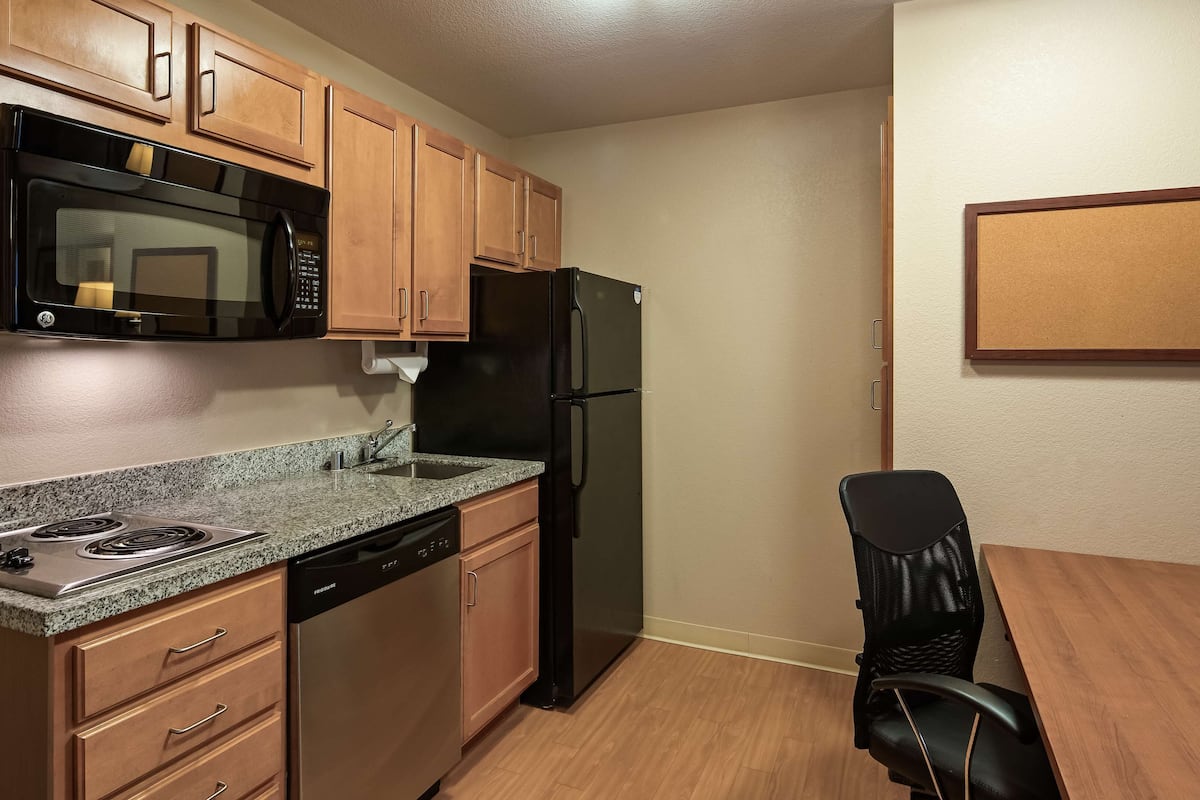 full-sized fridge, microwave, stovetop, dishwasher