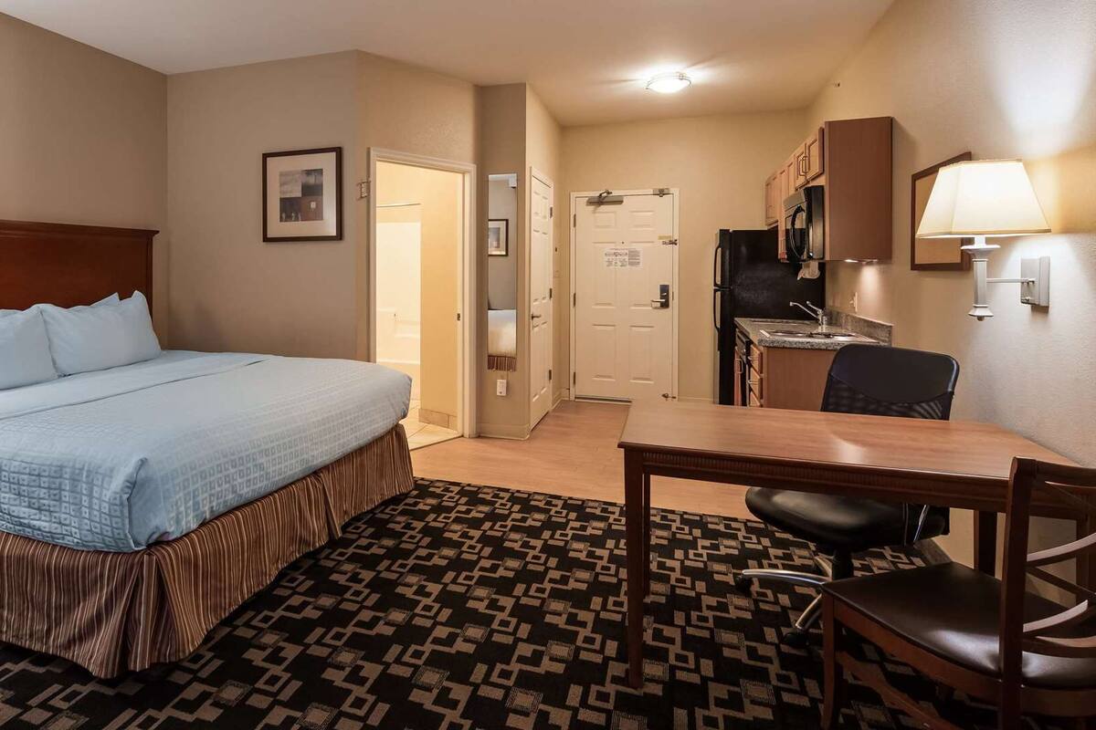 Desk, laptop workspace, blackout curtains, iron/ironing board