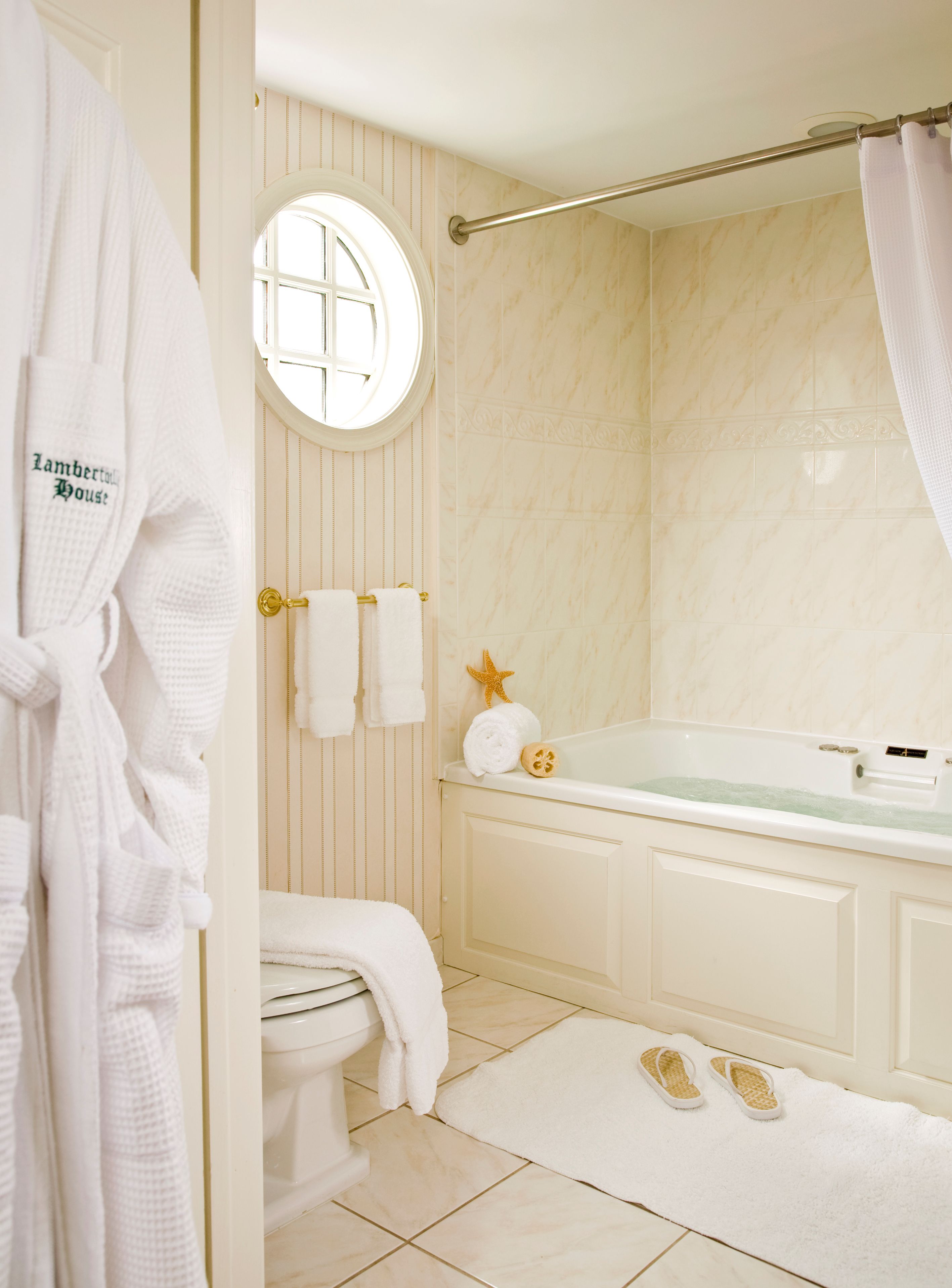 luxury queen room with balcony | bathroom | hair dryer, bathrobes, towels