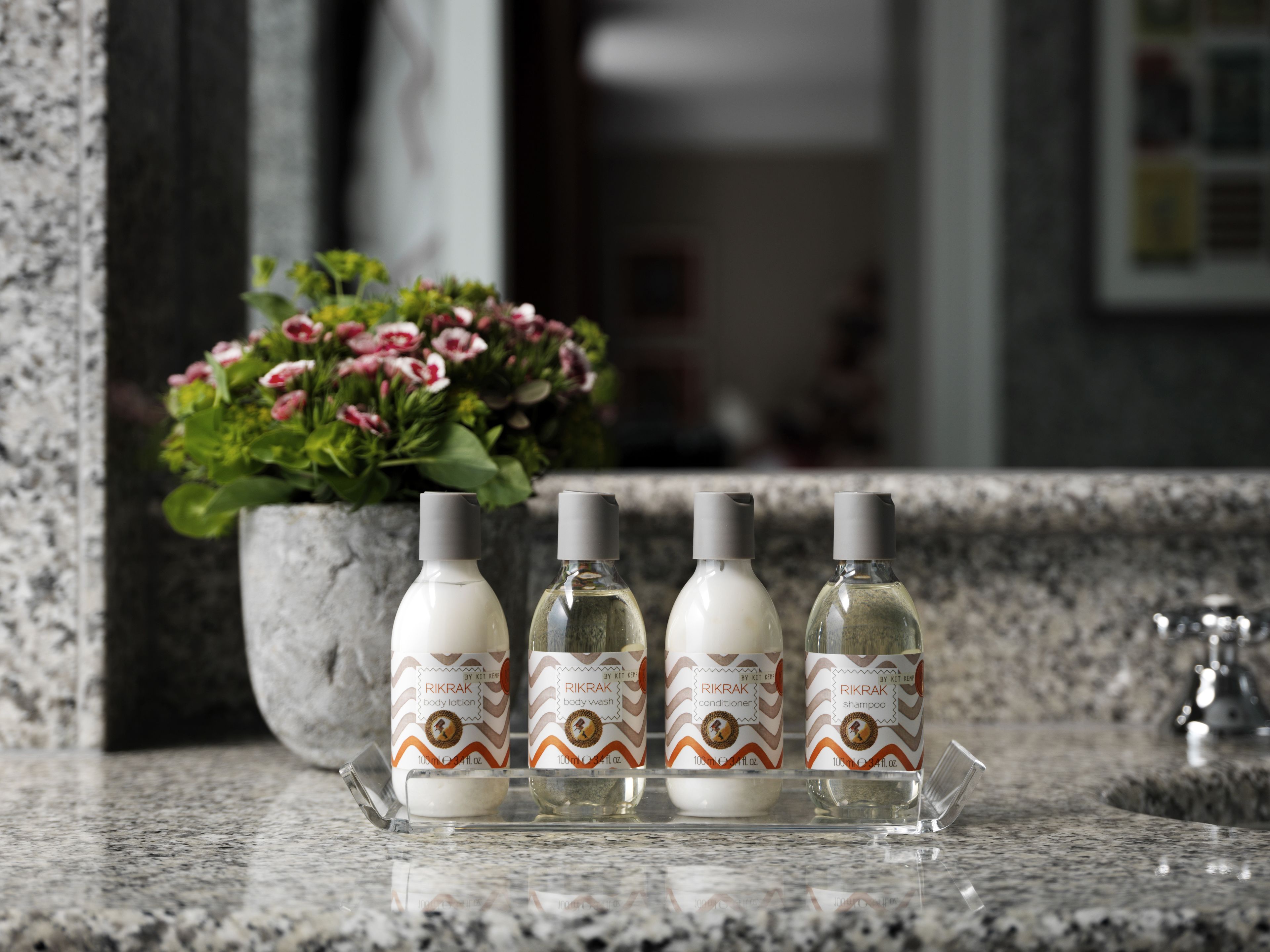 designer toiletries, hair dryer, bathrobes, slippers