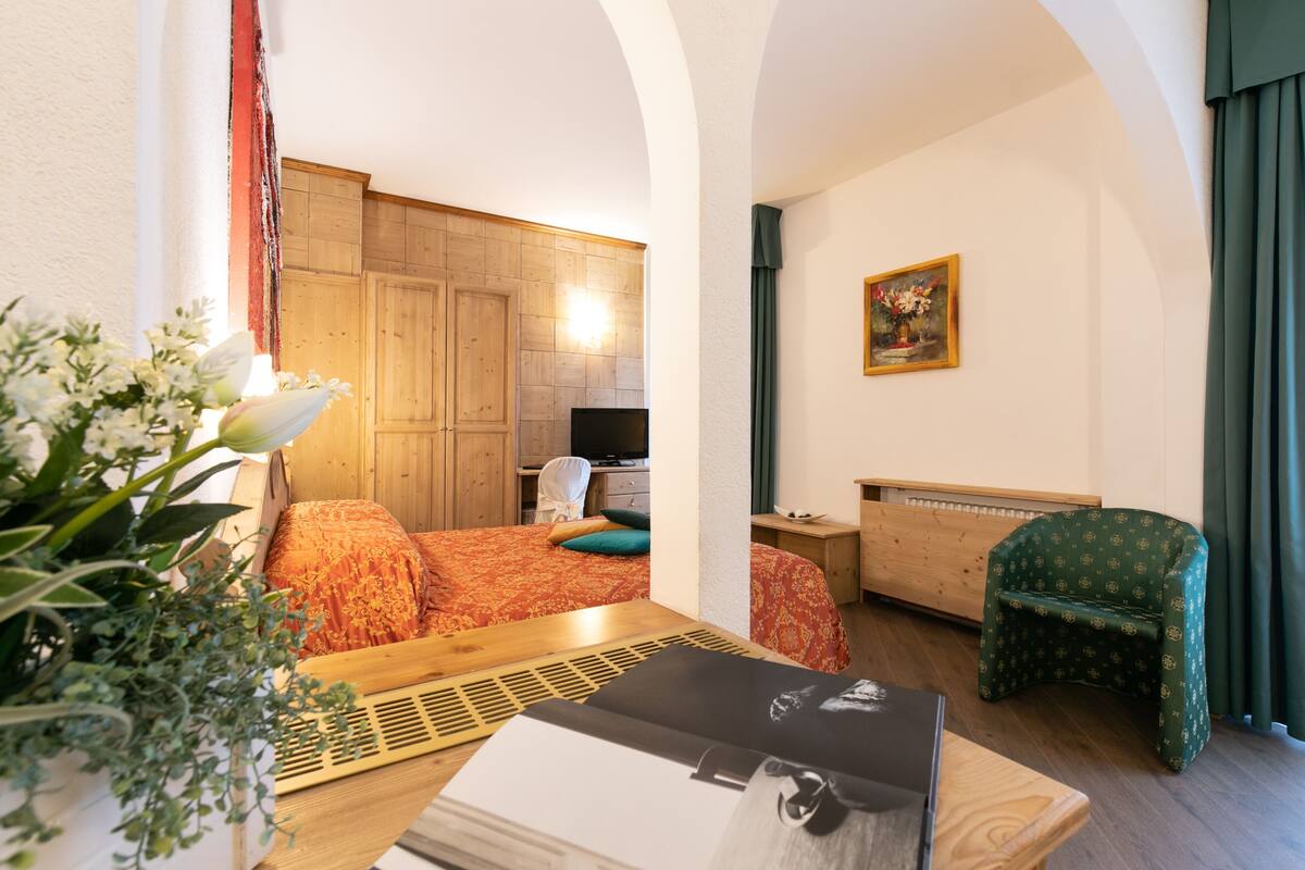 superior quadruple room, mountain view | minibar, in-room safe, desk, cots/infant beds