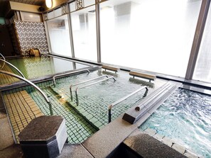 An indoor swimming pool with tiled flooring and metal handrails. - Hotel Monterey La Soeur Osaka (Osaka)