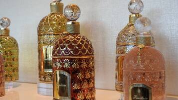 A collection of ornate perfume bottles with intricate designs and labels.