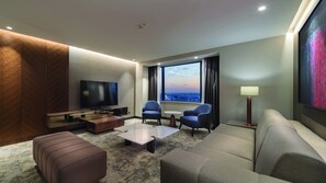 Deluxe Suite, 1 Bedroom | Living area | Flat-screen TV