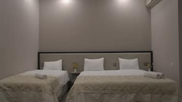 Habitación triple estándar | 1 habitación, ropa de cama de alta calidad y camas con efecto memoria