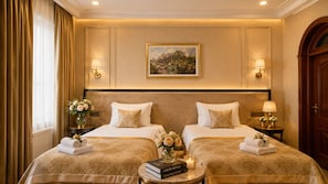 A hotel room with two beds, a painting on the wall, and a view of the outdoors. - Premier Hotel (Baku)