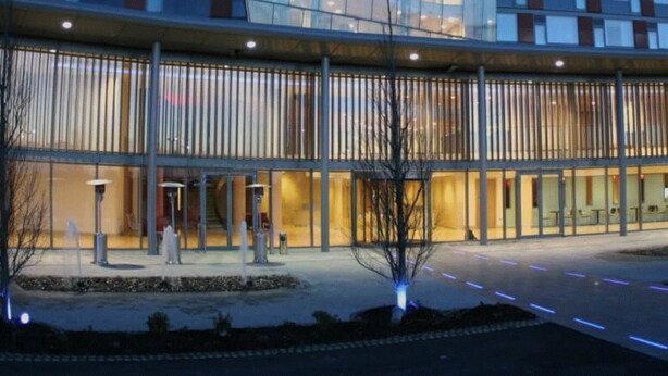 A modern building with a glass facade and a curved entrance. - Pillo Hotel & Leisure Club (Ashbourne)