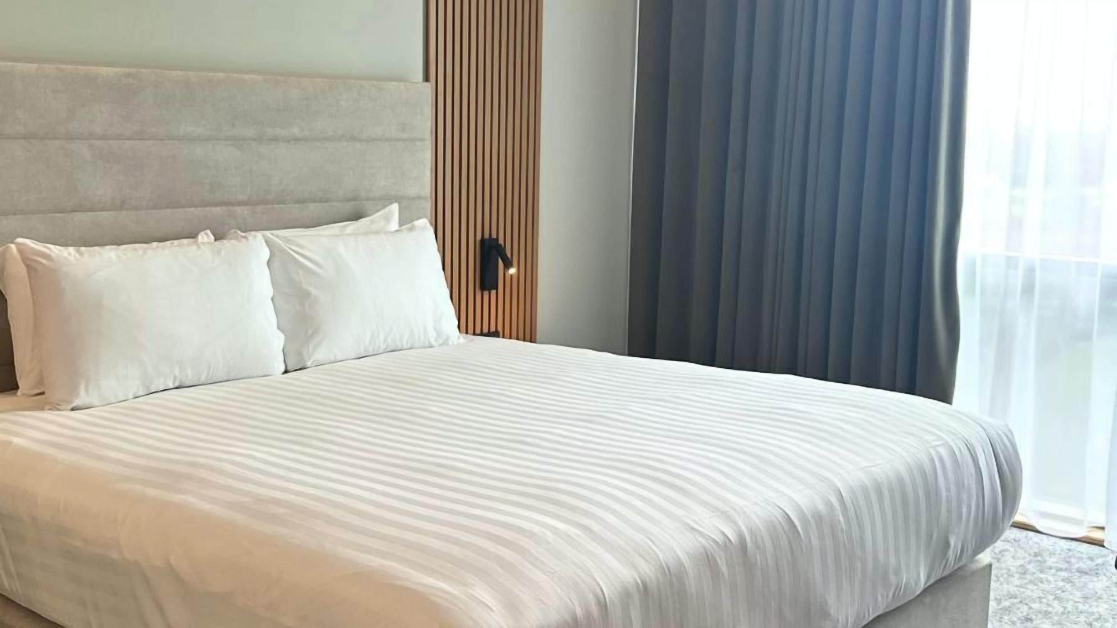 junior room, 1 king bed | in-room safe, desk, iron/ironing board, free wifi
