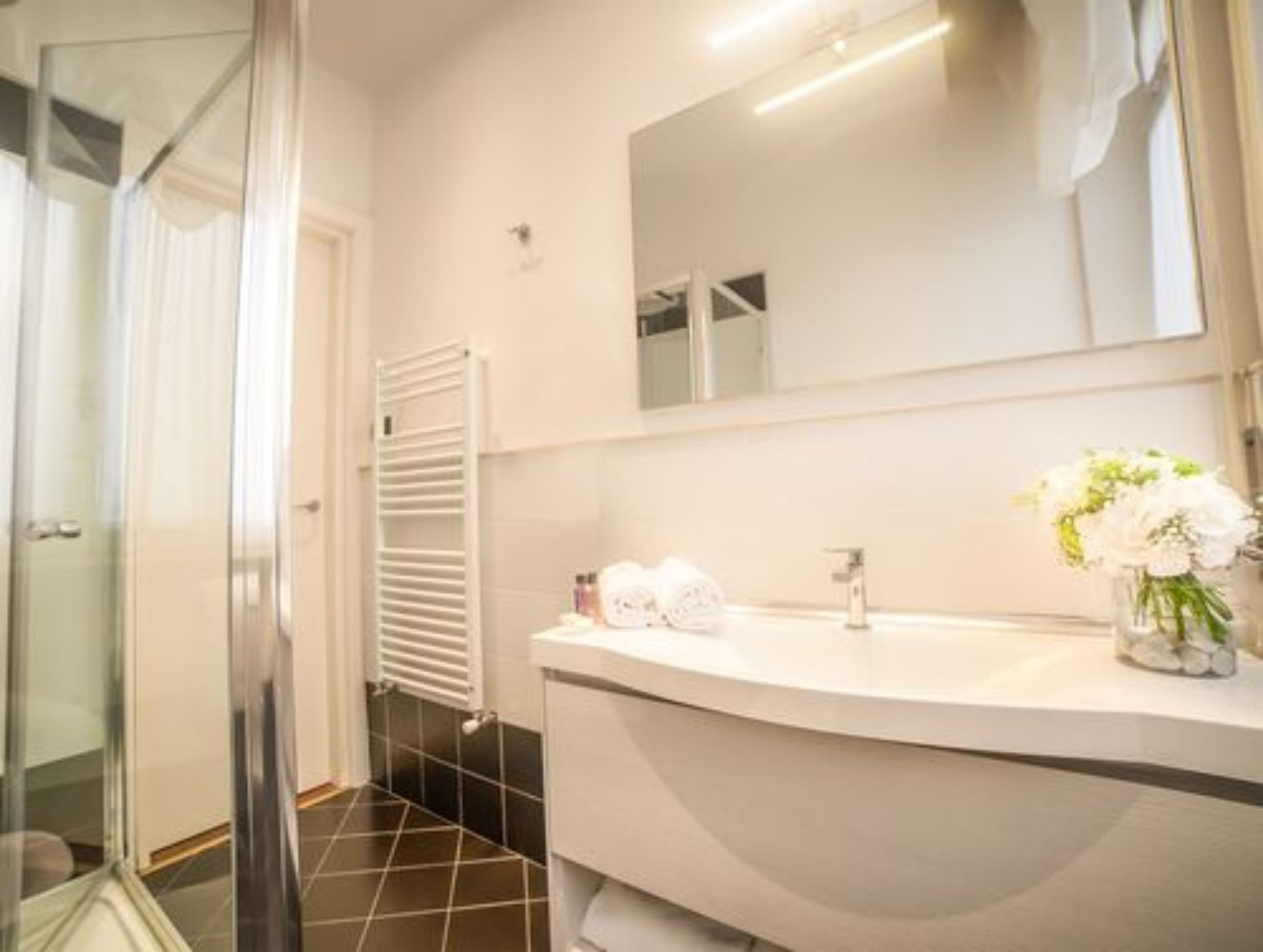 shower, rainfall showerhead, hair dryer, towels