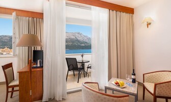 Superior junior suite, seaside | Minibar, in-room safe, desk, soundproofing