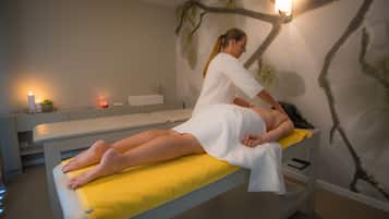 Experience a serene massage therapy session in a peaceful space with a skilled therapist, a soothing ambiance, and a calming atmosphere.