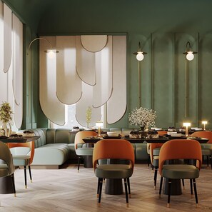 A modern interior with a sectional sofa, dining area, and pendant lighting. - Excelsior Hotel & Spa Baku, Curio Collection by Hilton (Baku)