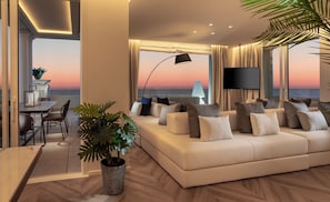 Suite de lujo | Área de sala de estar | Smart TV de 50 pulgadas con canales por cable