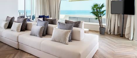 Luxury Suite | Living area | 50-inch Smart TV with cable channels