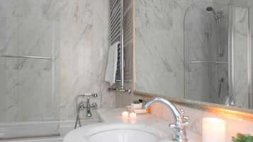 Bidet, towels, soap, toilet paper