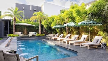 Outdoor pool, pool umbrellas, sun loungers
