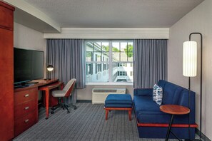 Suite, 1 Bedroom | Living room | 32-inch LCD TV with premium channels, TV