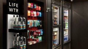 A vending area with various products including bottled water, snacks, and beverages. - Courtyard by Marriott Wall at Monmouth Shores Corporate Park (Neptune City)