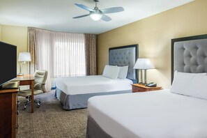Premium bedding, desk, laptop workspace, blackout drapes