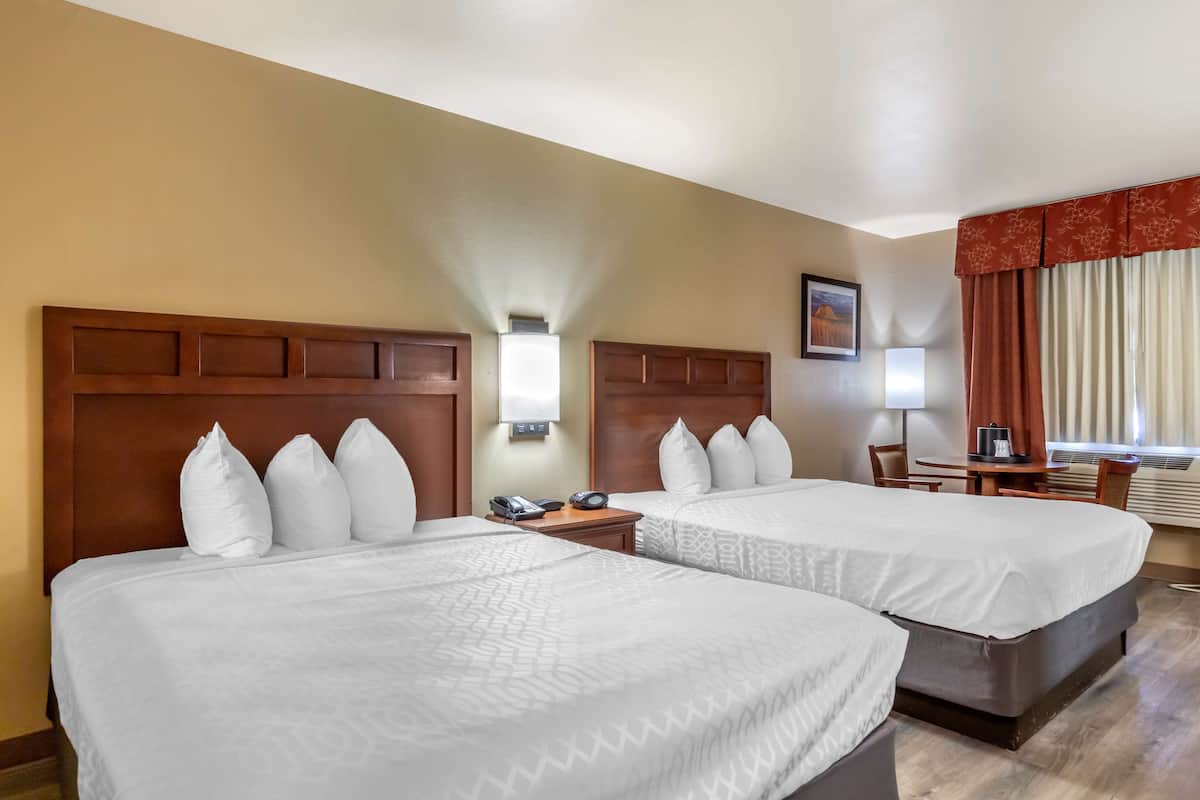 premium bedding, desk, laptop workspace, iron/ironing board