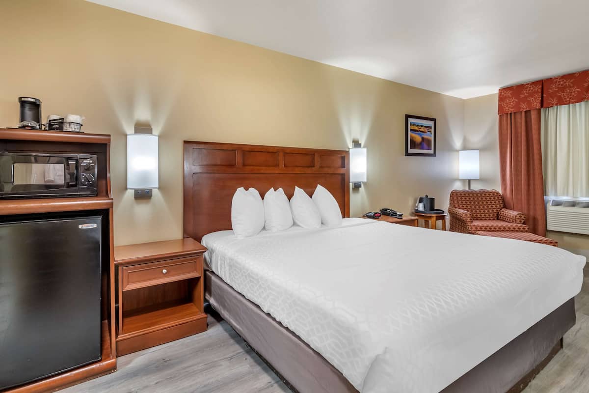 Premium bedding, desk, laptop workspace, iron/ironing board
