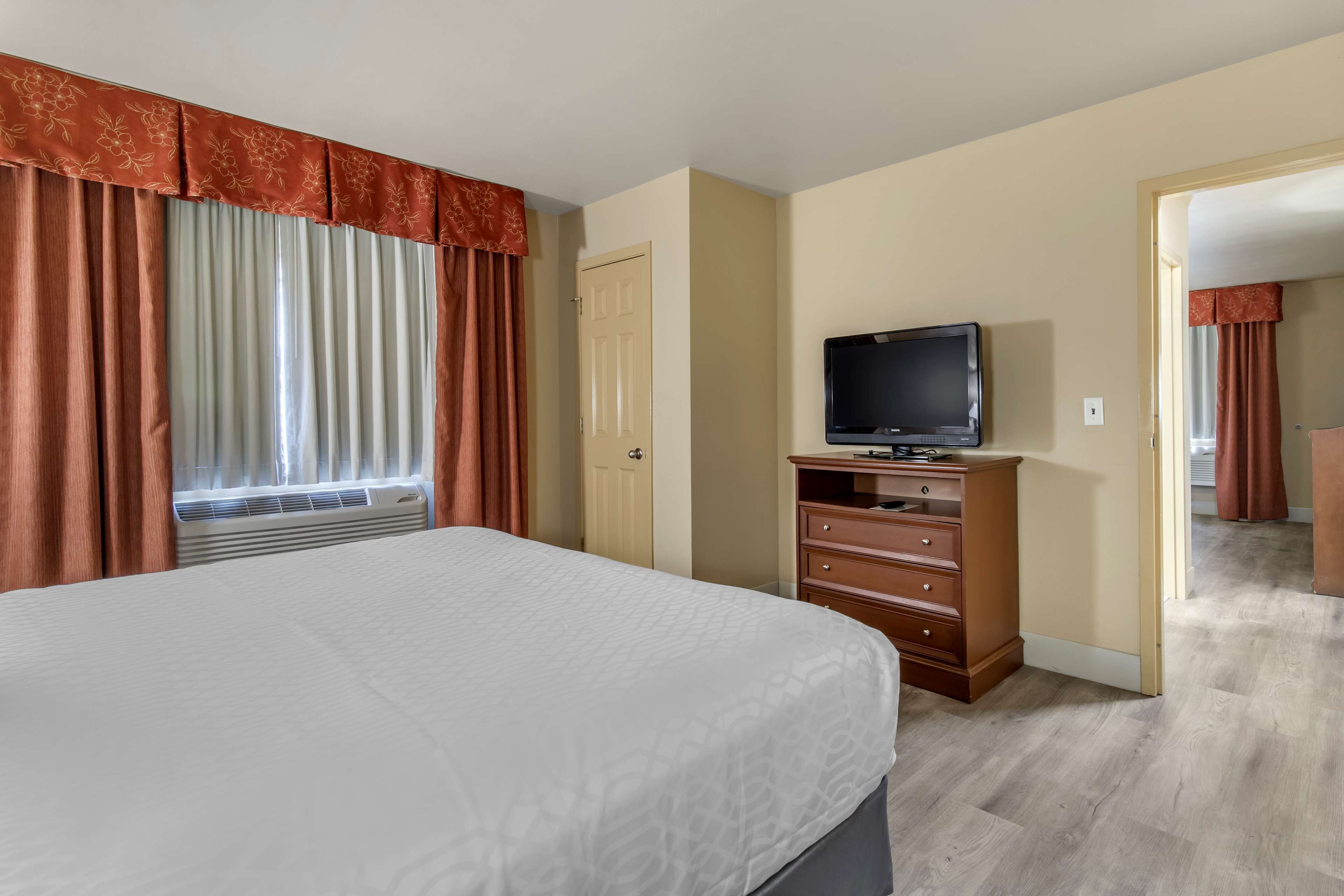 premium bedding, desk, laptop workspace, iron/ironing board