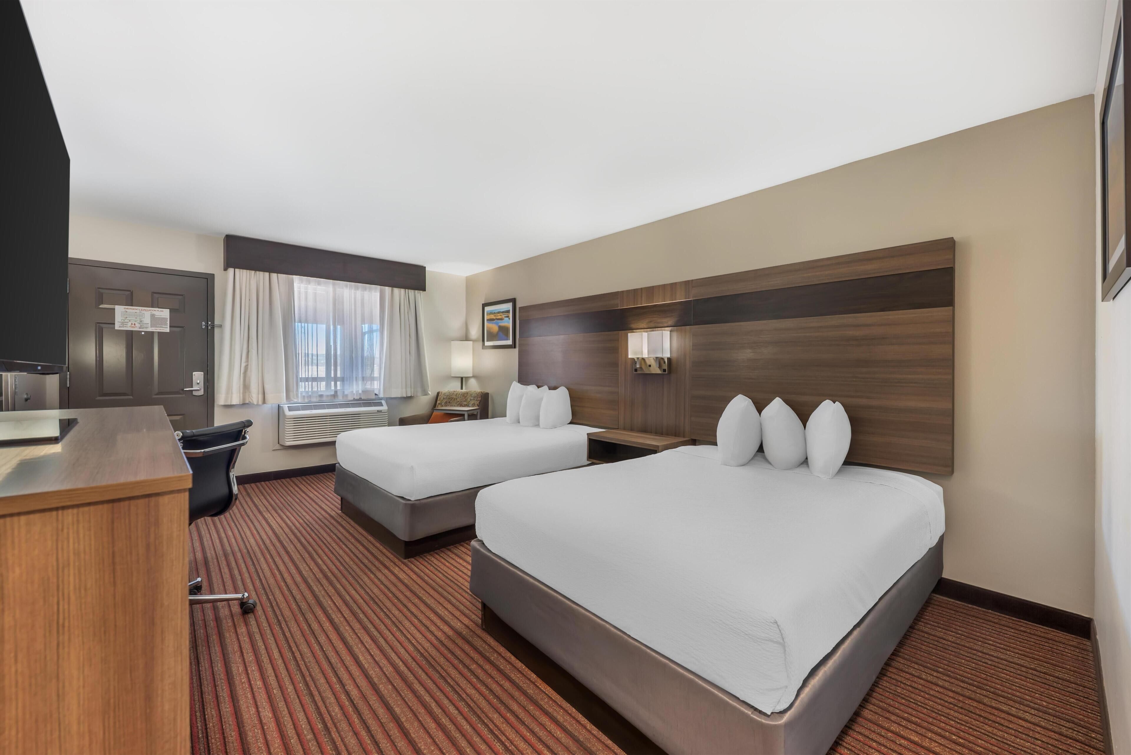 Premium bedding, desk, laptop workspace, iron/ironing board
