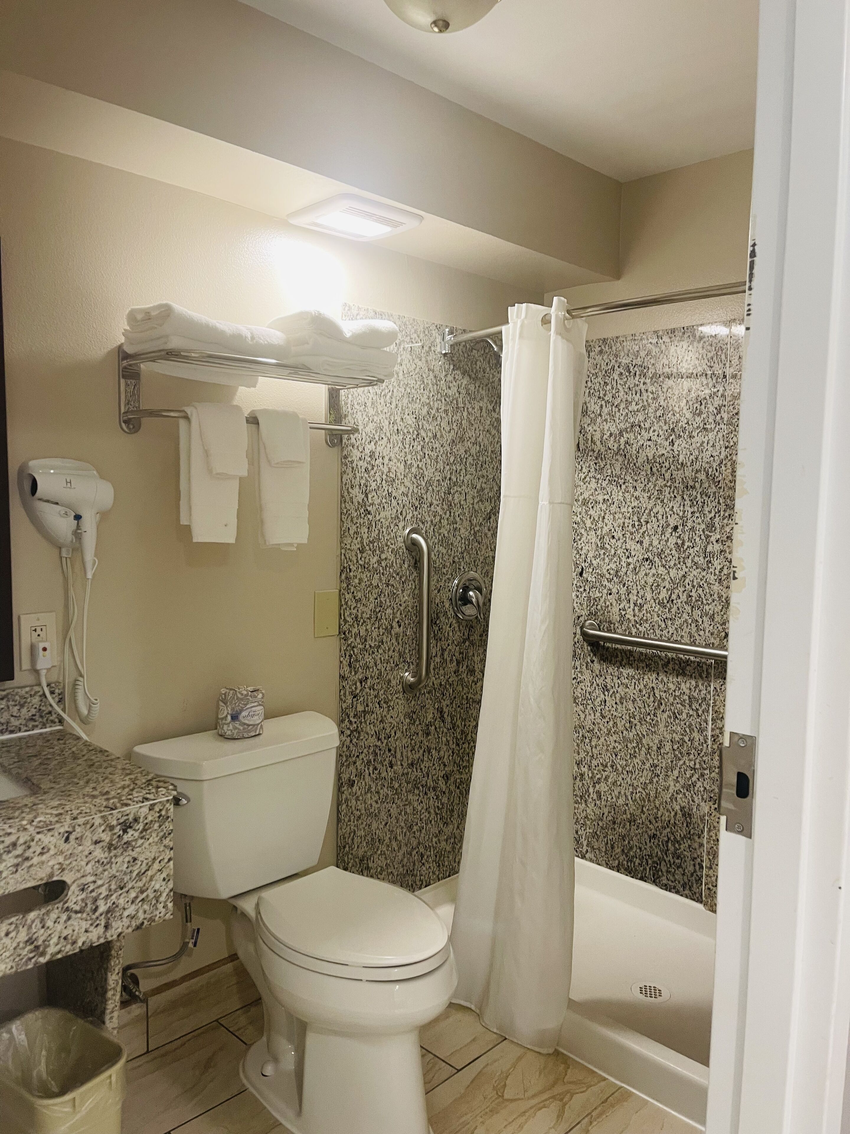 superior room, multiple beds | bathroom | combined shower/bathtub, hair dryer, towels
