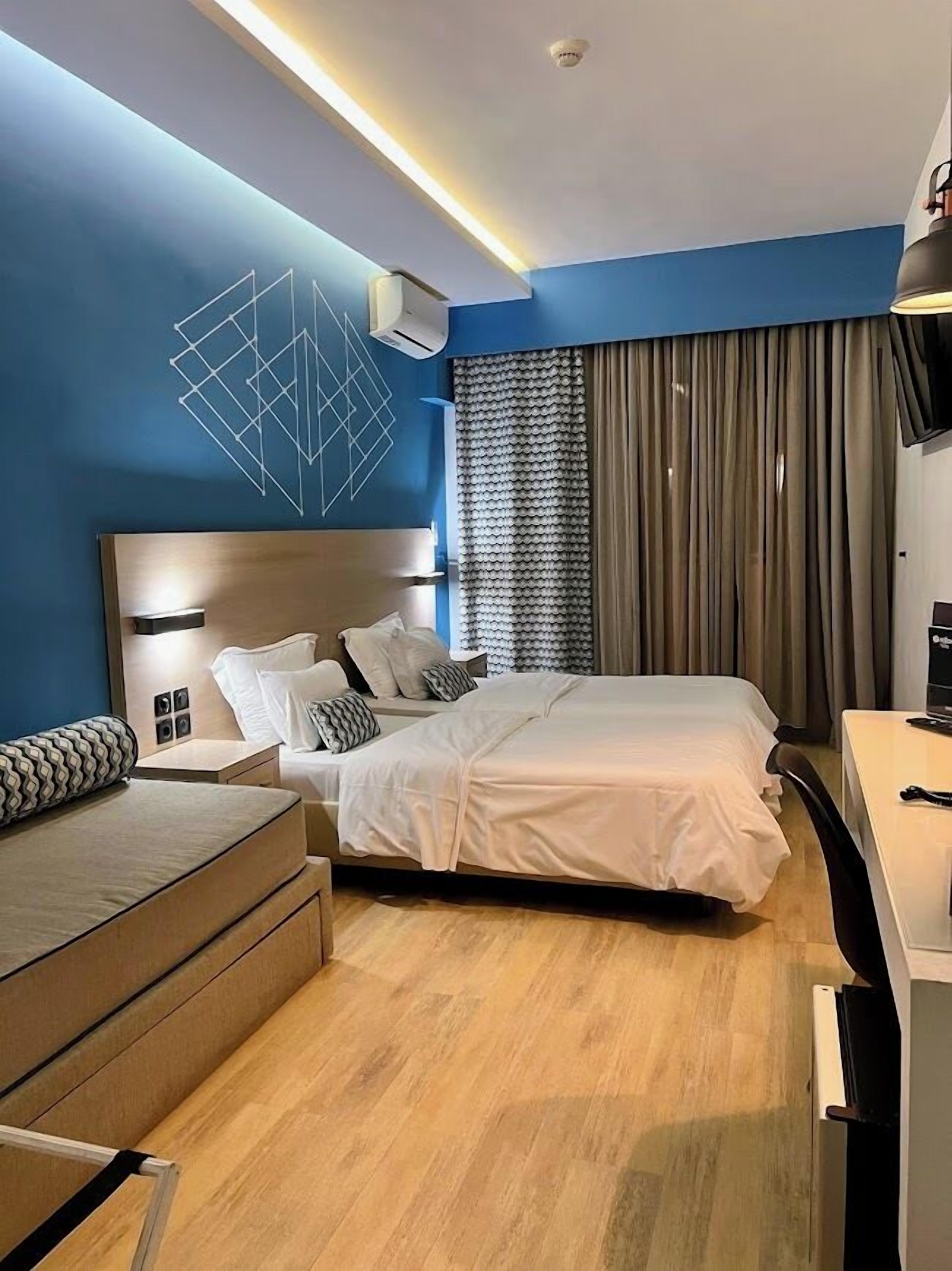 Connected Comfort | Hypo-allergenic bedding, in-room safe, desk, blackout drapes