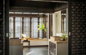 Separate bathtub and shower, rainfall showerhead, designer toiletries