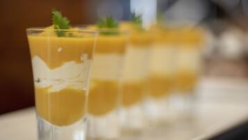 A dessert tray with layered parfaits.