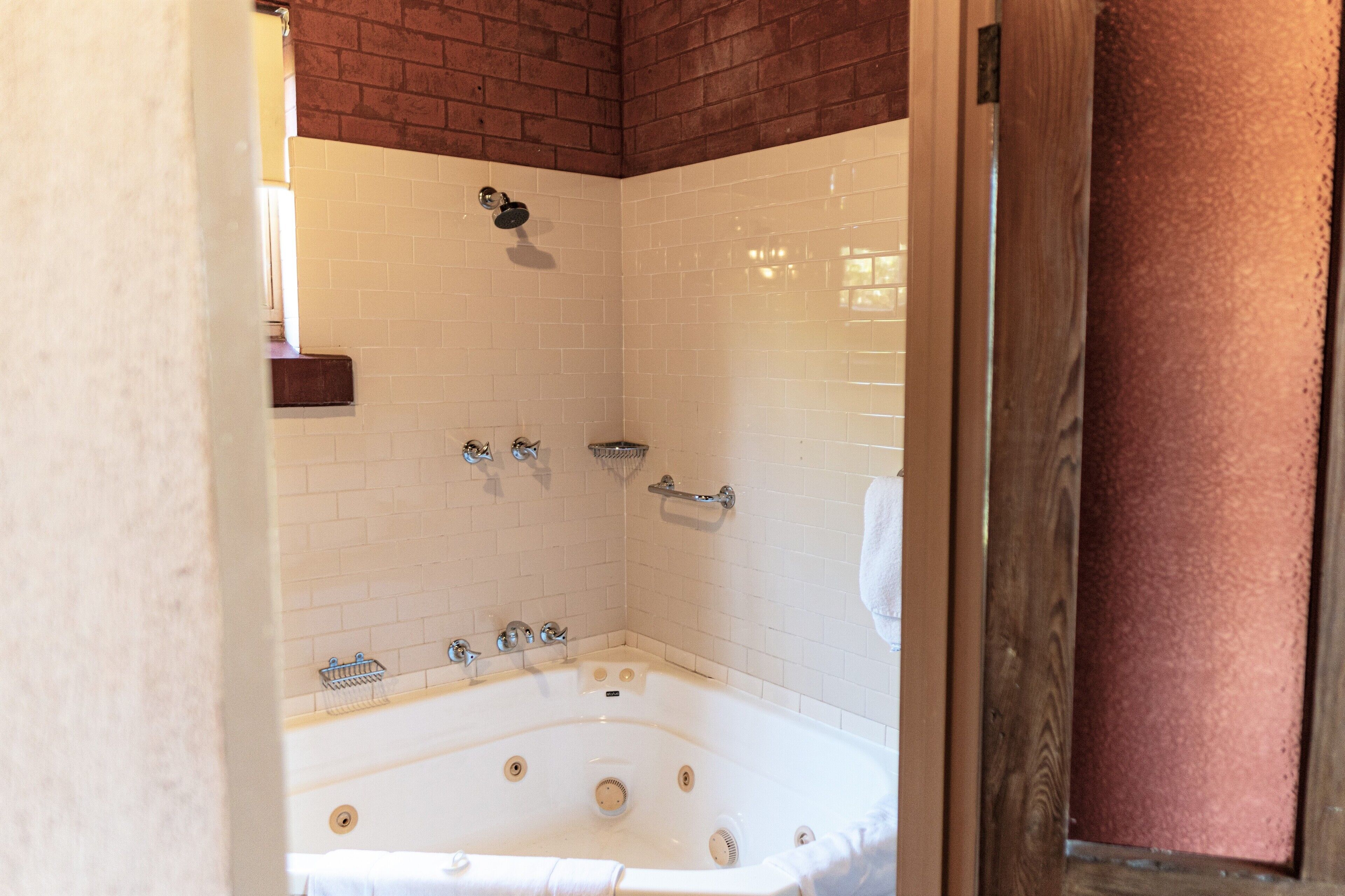 paprika spa cottage | bathroom | designer toiletries, hair dryer, towels