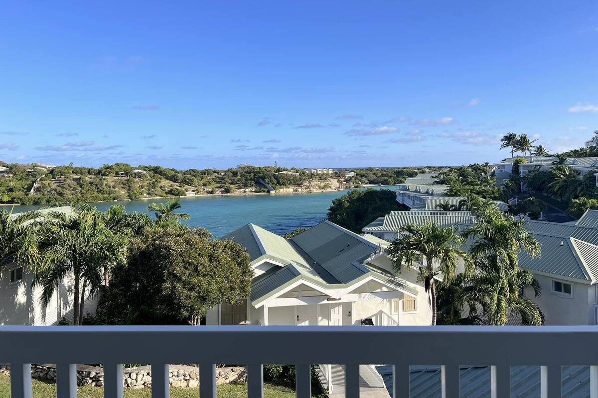 A coastal view with houses and a beach.