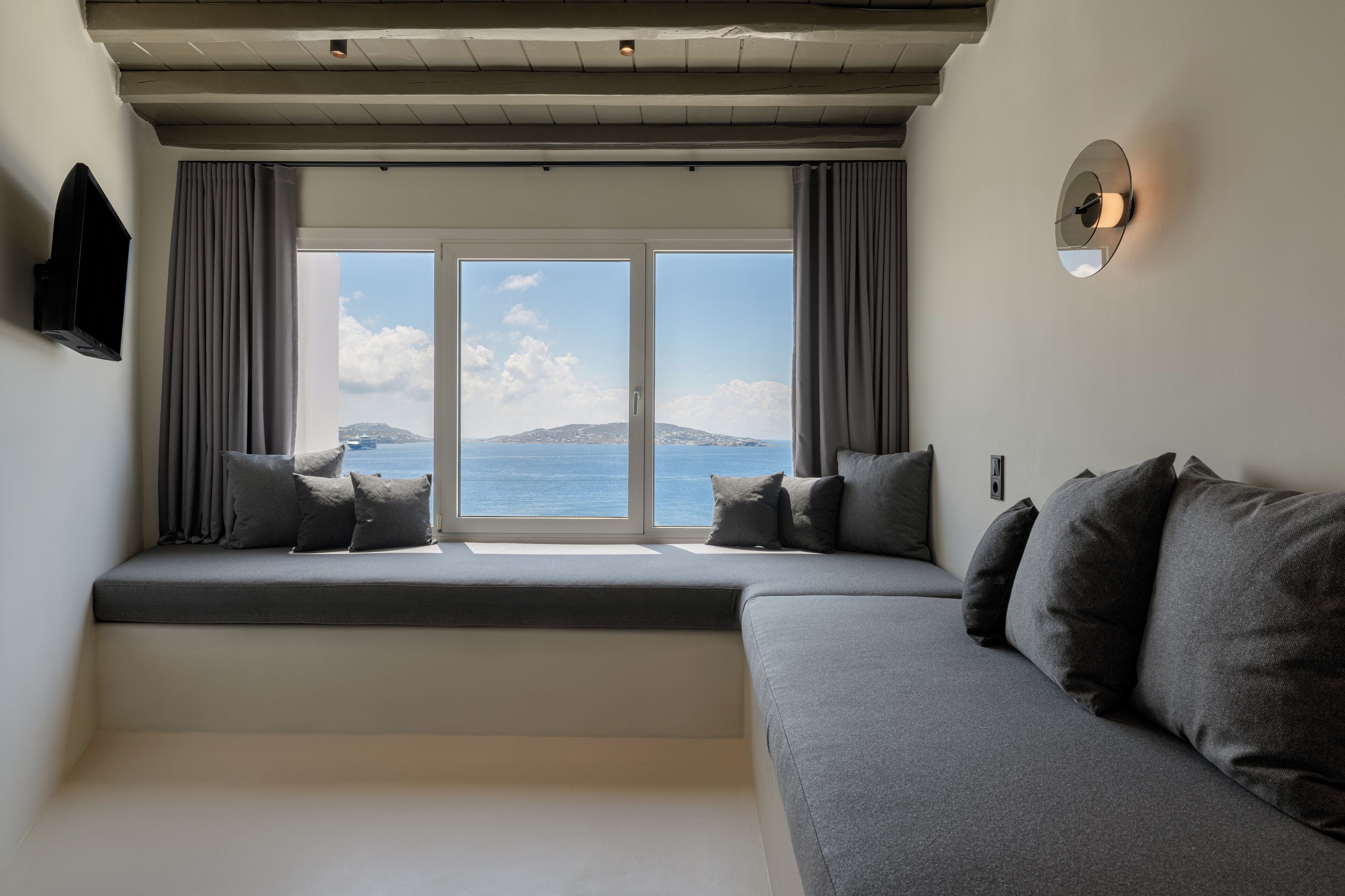 deluxe sea view suite (outdoor mini plunge pool) | living area | lcd tv