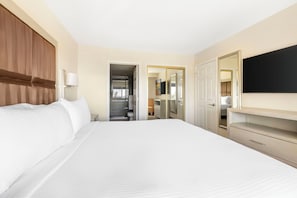 Laptop workspace, bed sheets