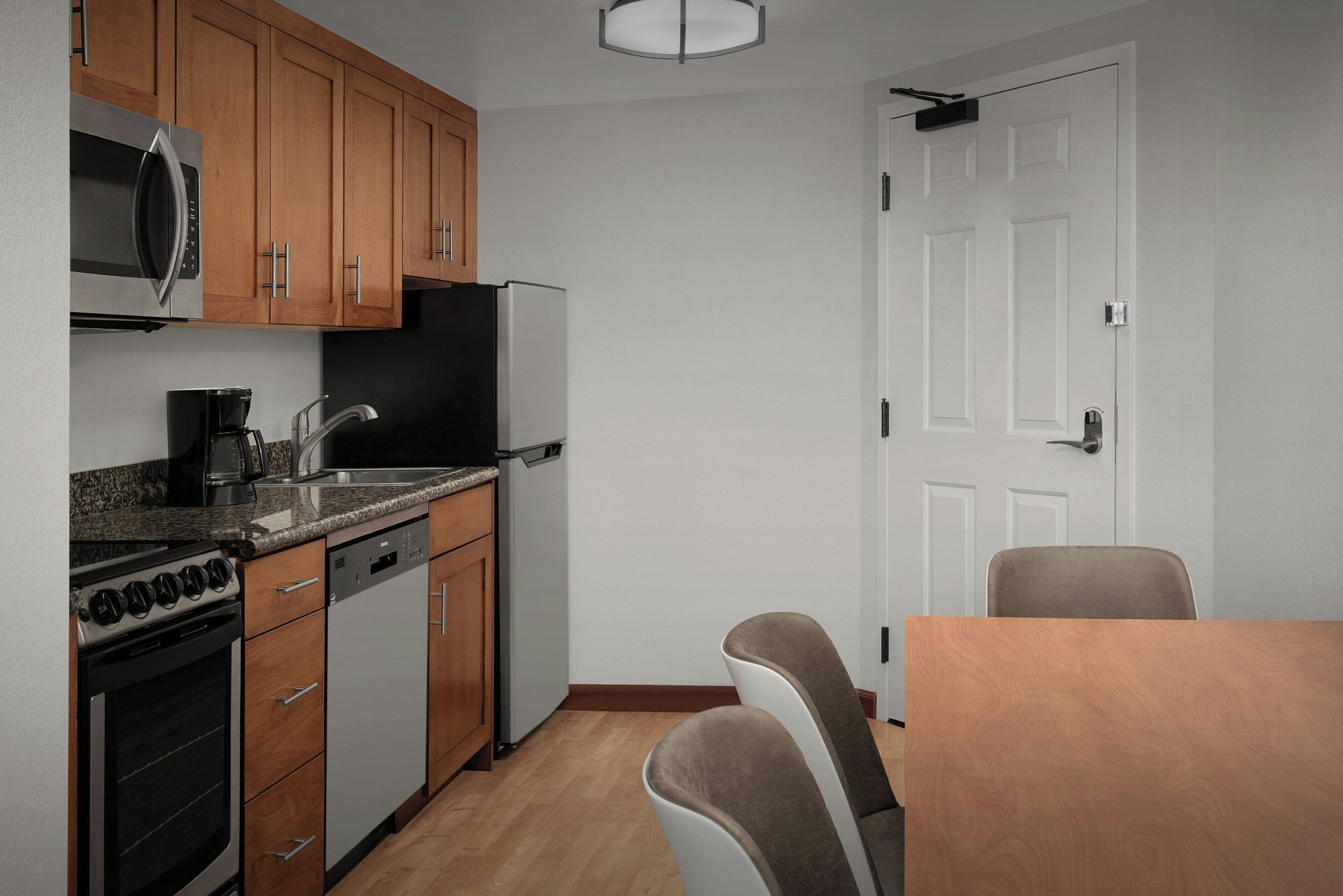 full-sized fridge, microwave, stovetop, dishwasher