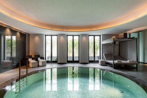 Indoor pool, open 9:00 AM to 8:00 PM, pool loungers