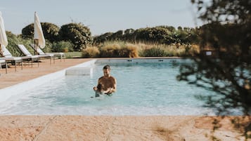 Outdoor pool, pool umbrellas, sun loungers