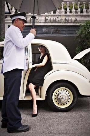A vintage car parked in front of a building with a sign that reads "ELGENIA." - The Eugenia Hotel & Spa (Bangkok)