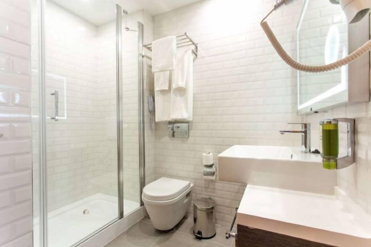 Shower, eco-friendly toiletries, hair dryer, slippers