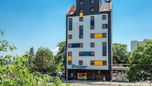 A multi-story hotel with a modern design, featuring a mix of rectangular and square windows, and a prominent sign for 'Best Western'. - Best Western Terminus Hotel (Sofia)