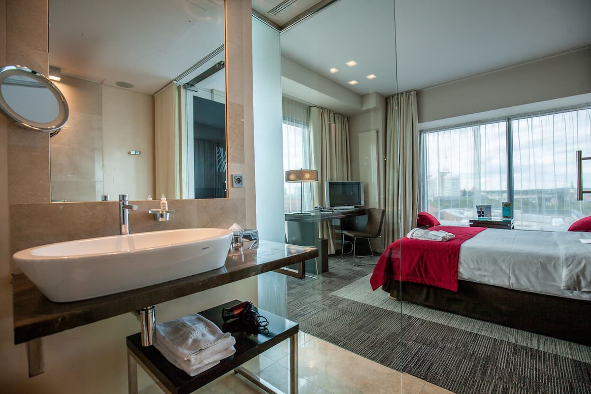 junior suite | bathroom | shower, designer toiletries, towels