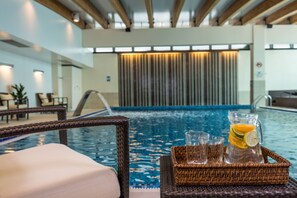 Indoor pool, open 6:00 AM to 10:00 PM, pool loungers, lifeguards on site