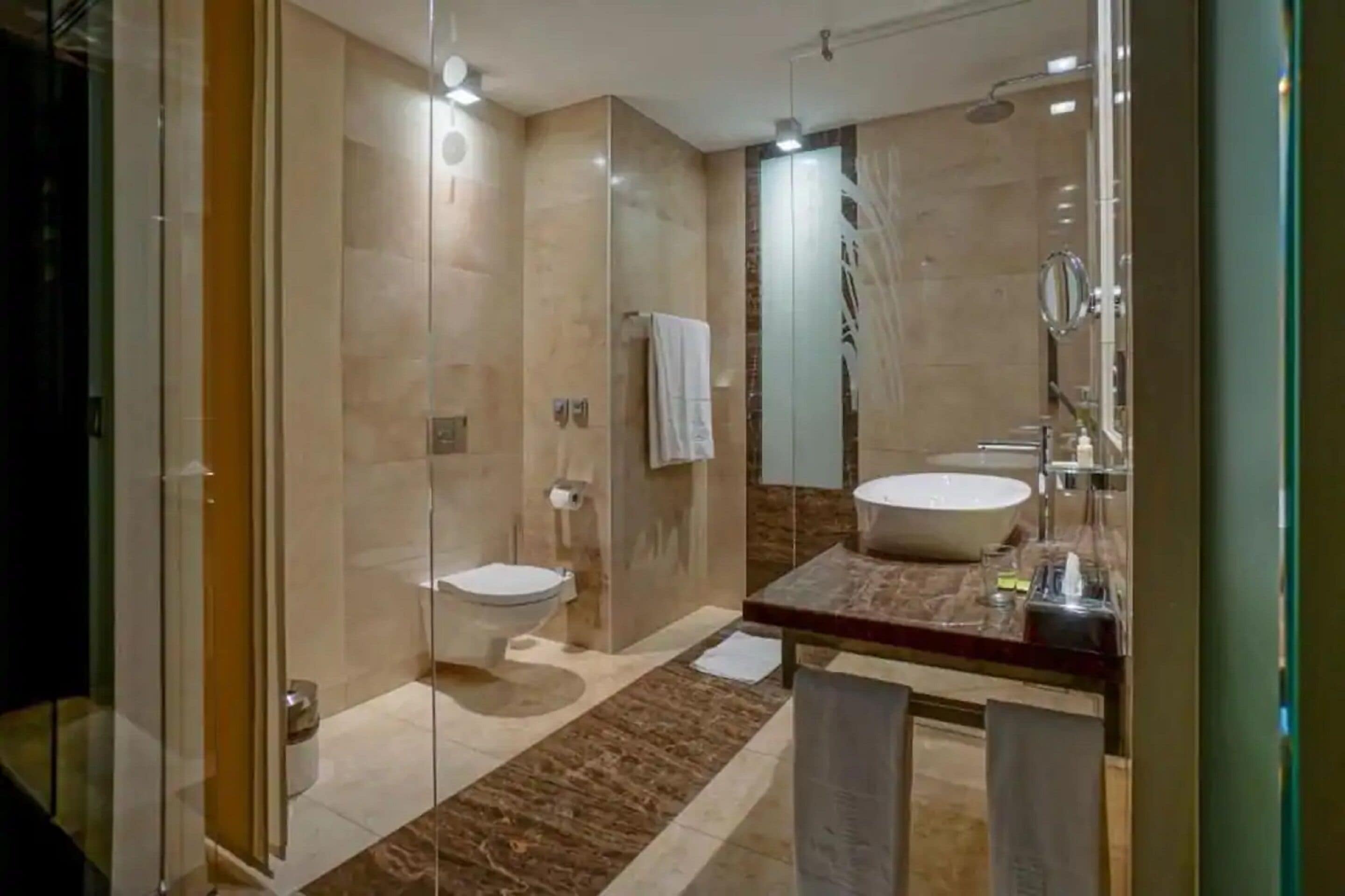 shower, designer toiletries, towels